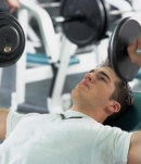 man lifting weights